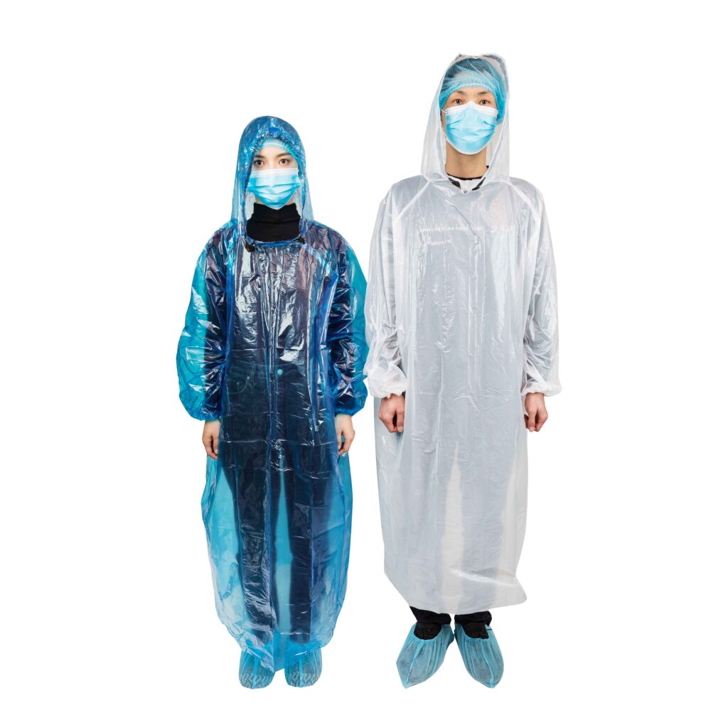 Two people wearing medical protective gear.