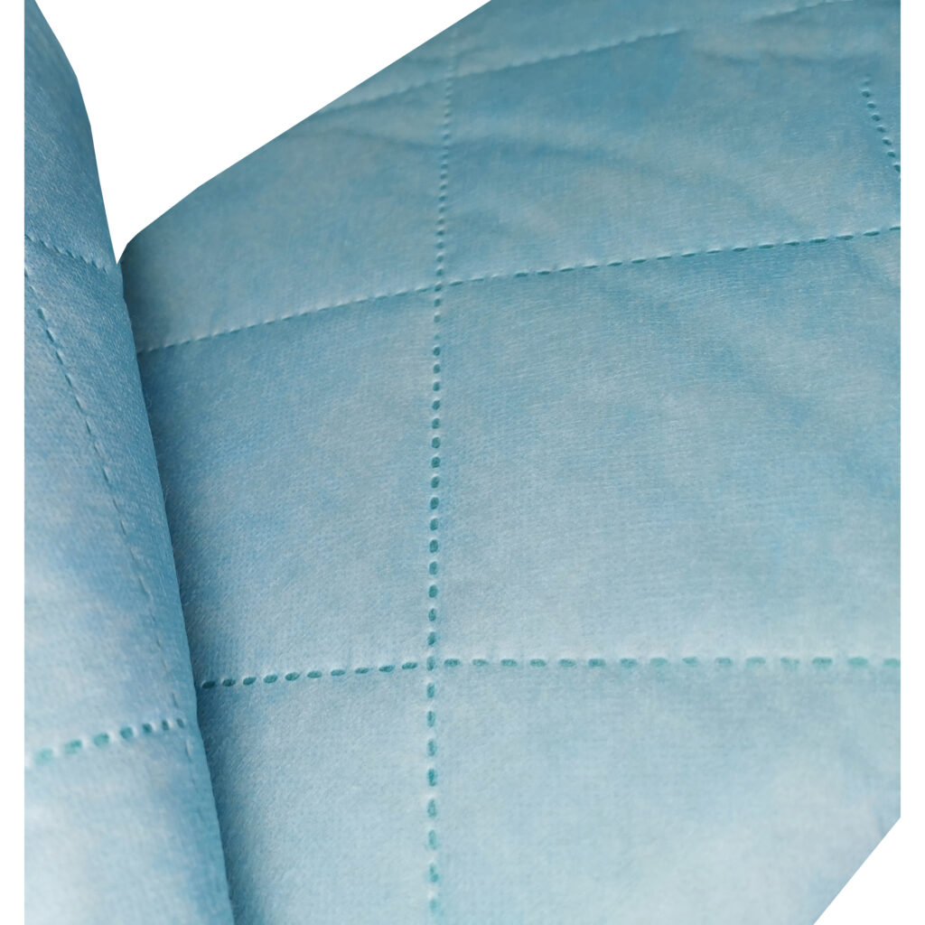 Close-up of quilted blue fabric texture