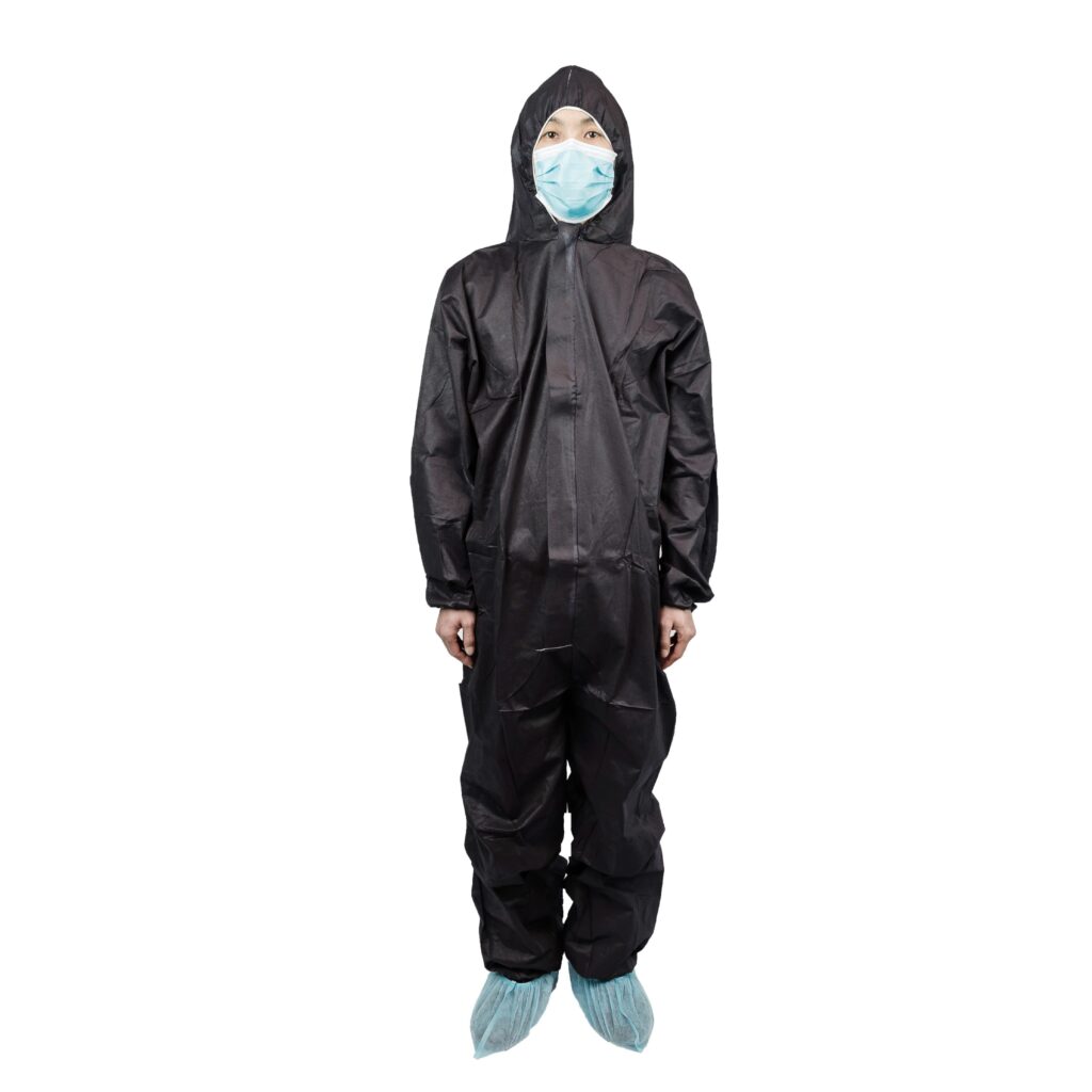 Person in black protective coverall with mask.