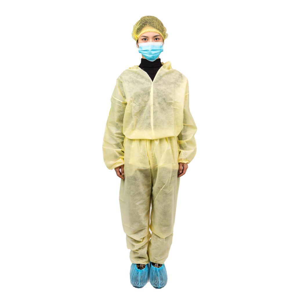 Person wearing protective medical clothing and mask.