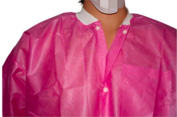 Pink disposable lab coat with white collar.