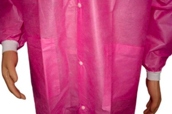 Pink disposable gown with mannequin arms