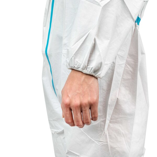 Close-up of hand in white protective suit