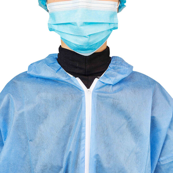 Person wearing protective gown and face mask