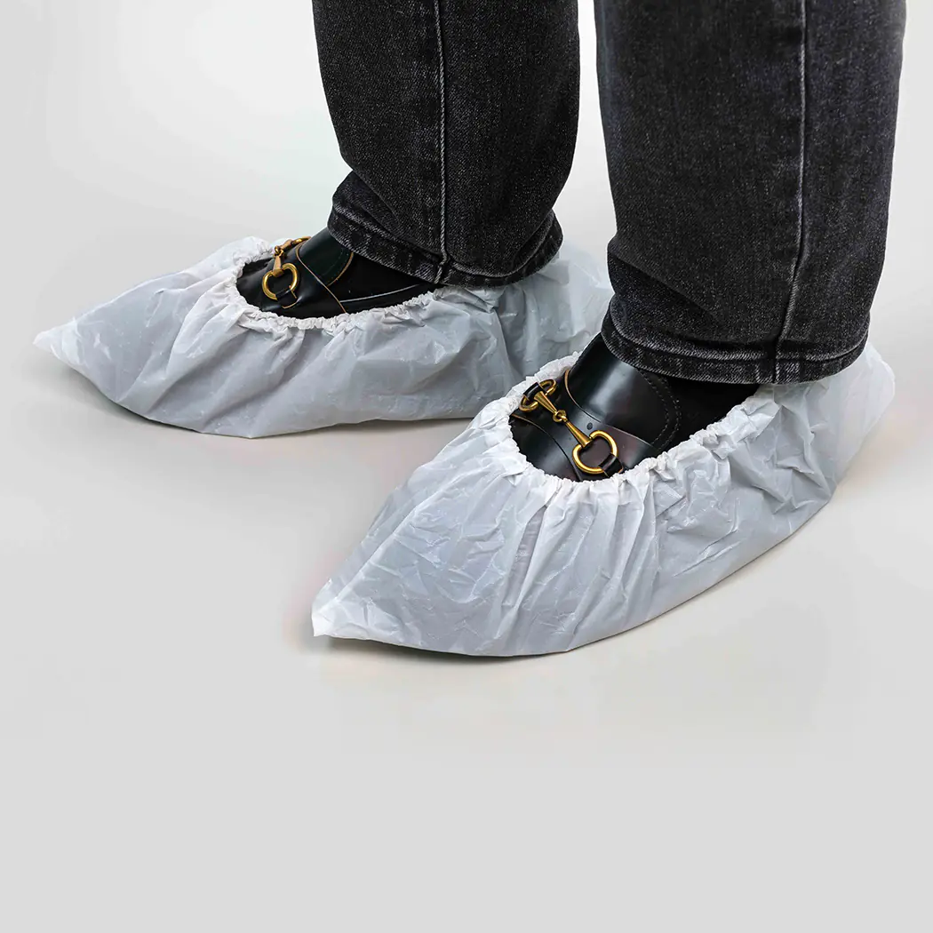 Shoes covered with disposable booties