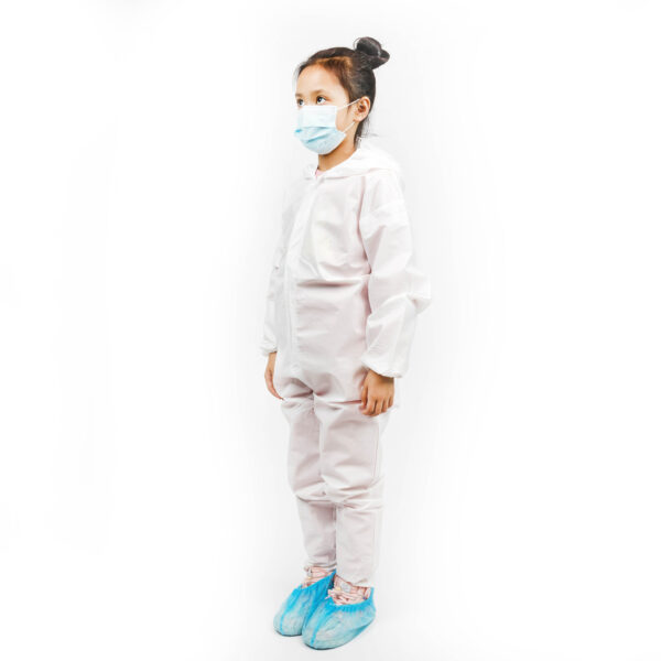 Child wearing protective medical suit and mask