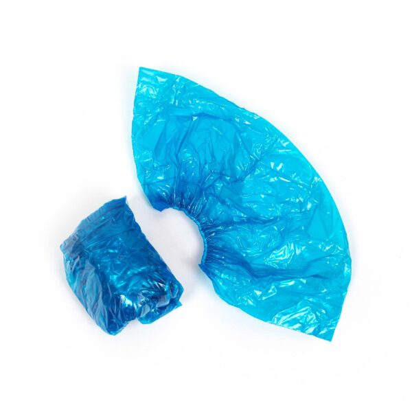 Blue disposable shoe covers on white background.