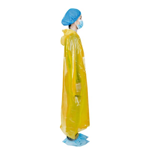 Person in yellow protective gown and mask