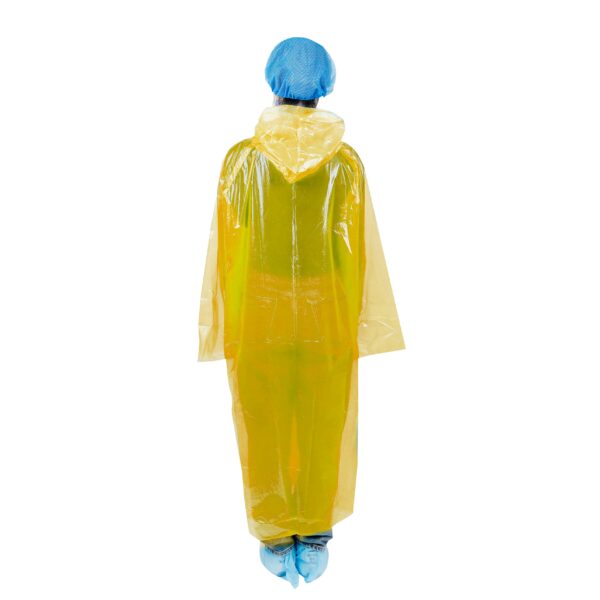 Person in yellow protective gown and blue cap.