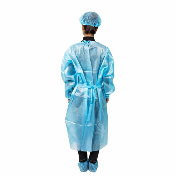 Person wearing blue protective gown and cap.