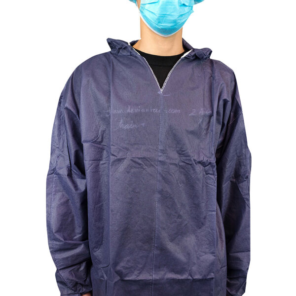 Person wearing blue protective gown and mask.