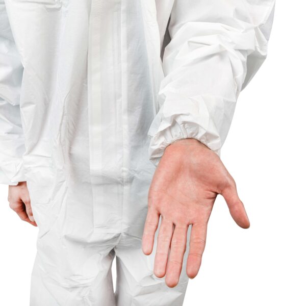 Person in protective suit showing open hand