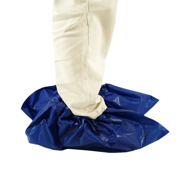 Leg wearing blue protective shoe cover