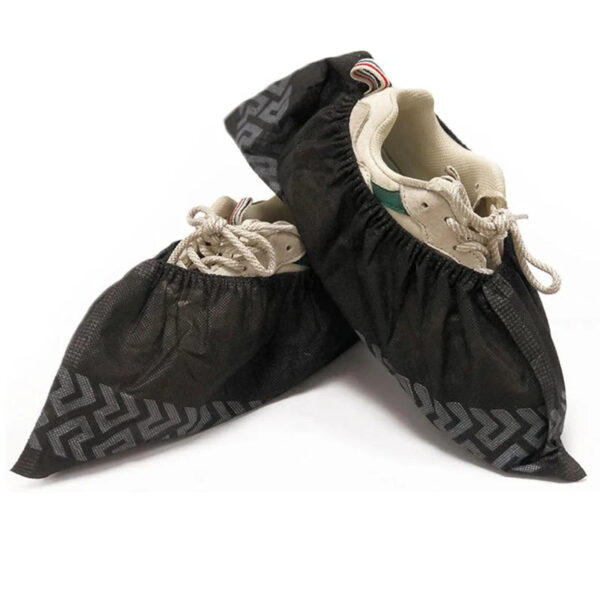 Shoes with black protective covers for rain.