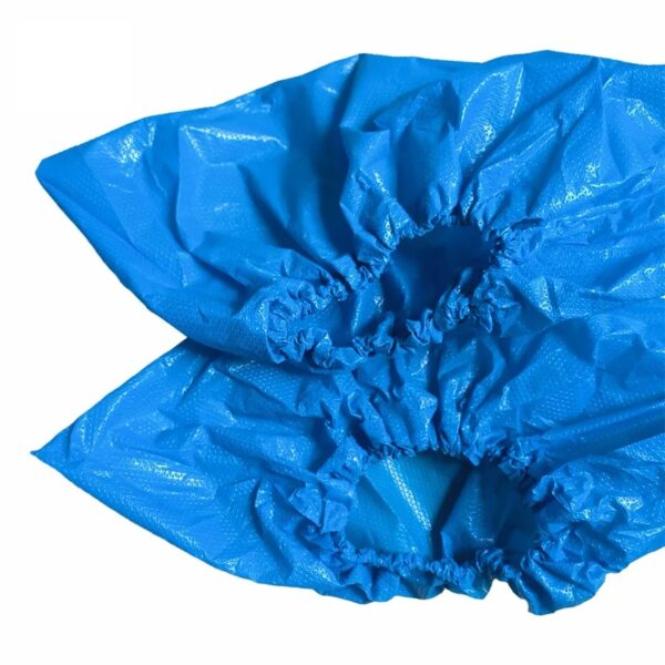 Blue disposable shoe covers for protection.