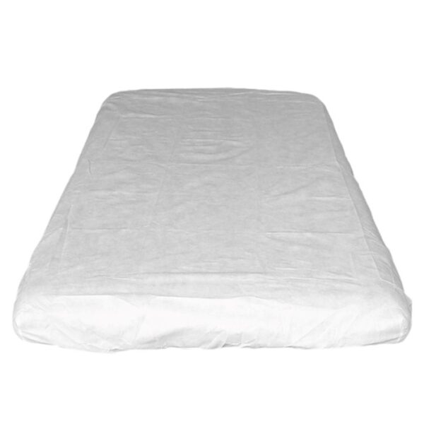 White mattress topper on a bed