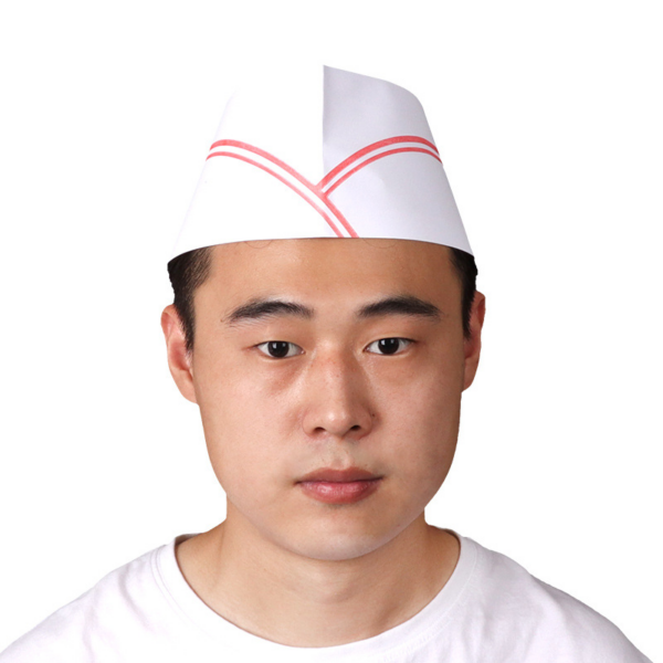 Man wearing paper hat and white shirt