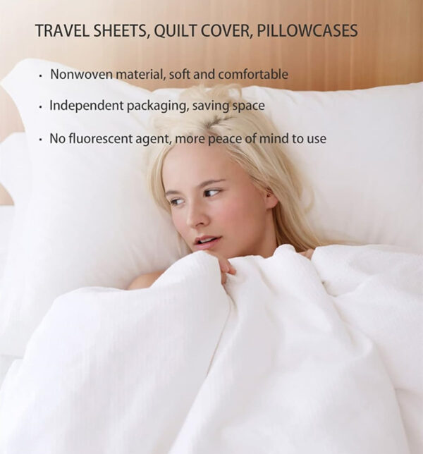 Woman relaxing in soft, comfortable travel sheets.