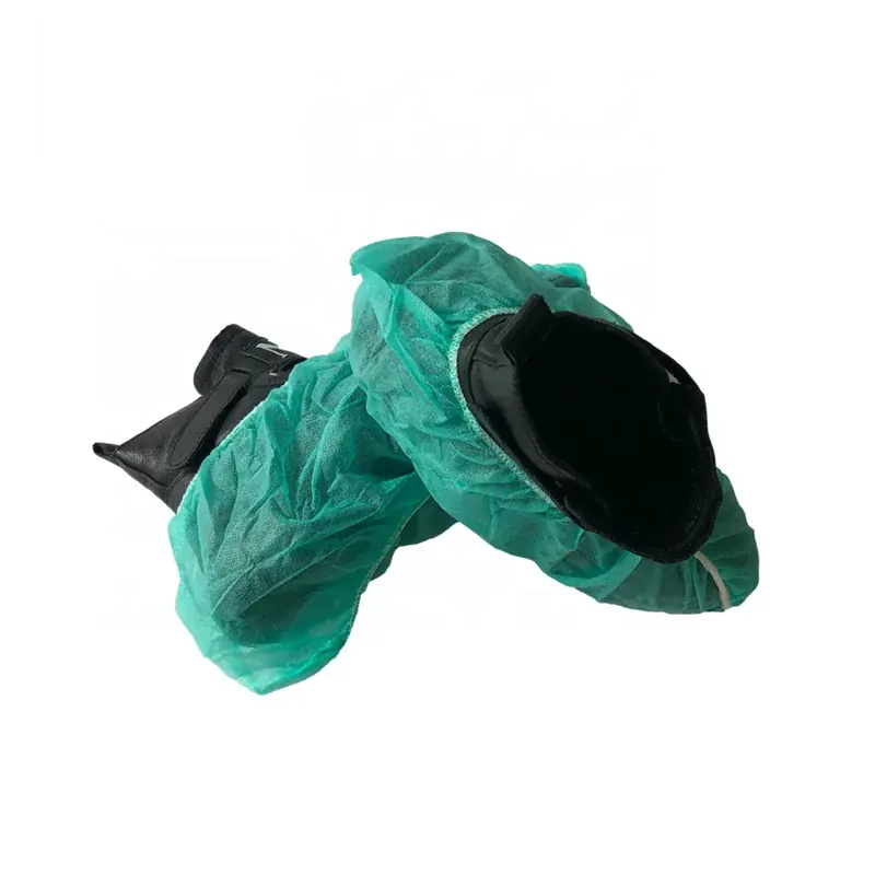 Disposable shoe covers in green fabric