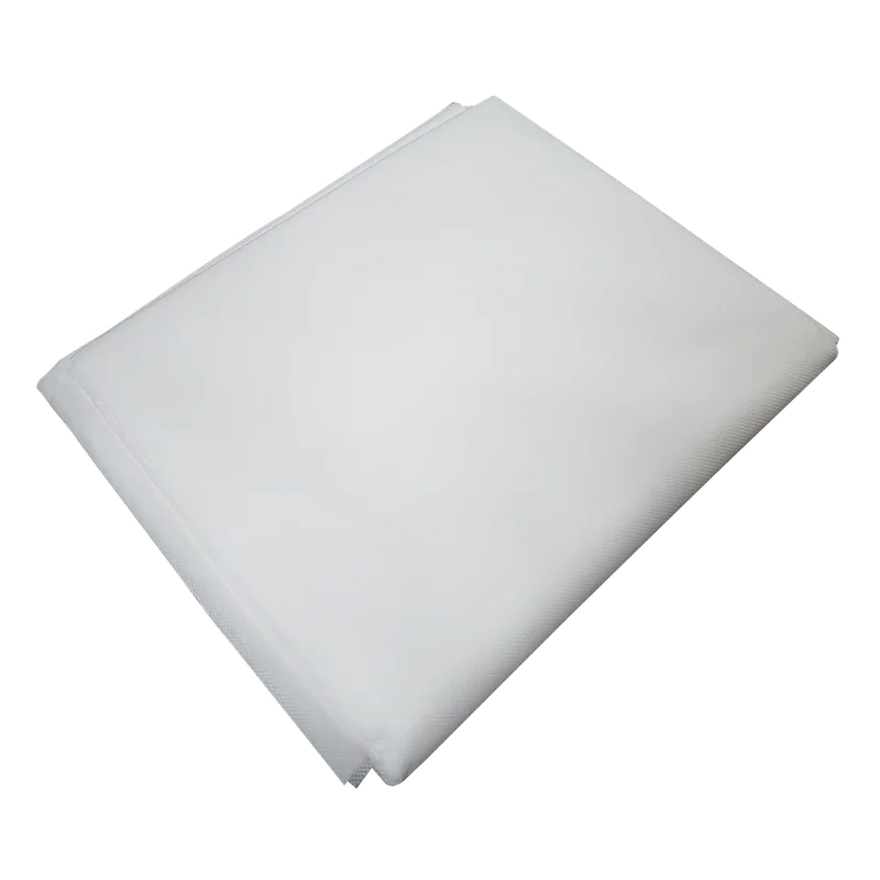 Folded white fabric on grey background.