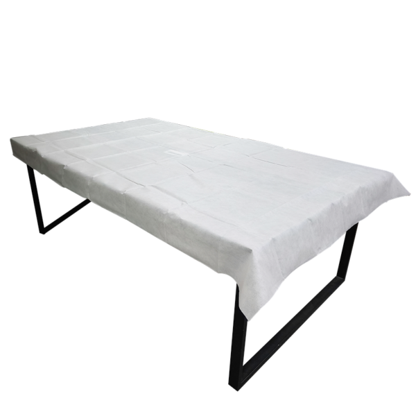 Table with white disposable tablecloth