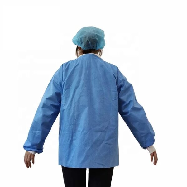 Person in blue medical gown and cap