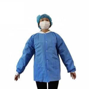 Person wearing blue medical gown and mask