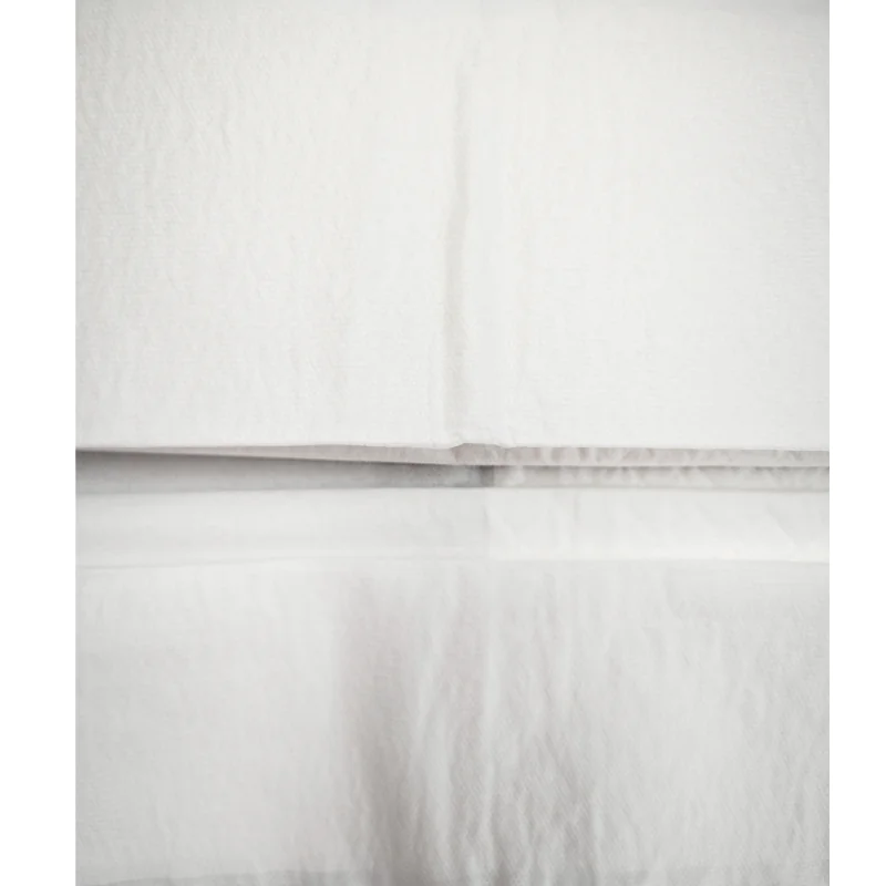 Close-up of stacked white towels