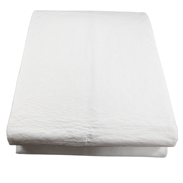 Folded white bedsheet on plain background