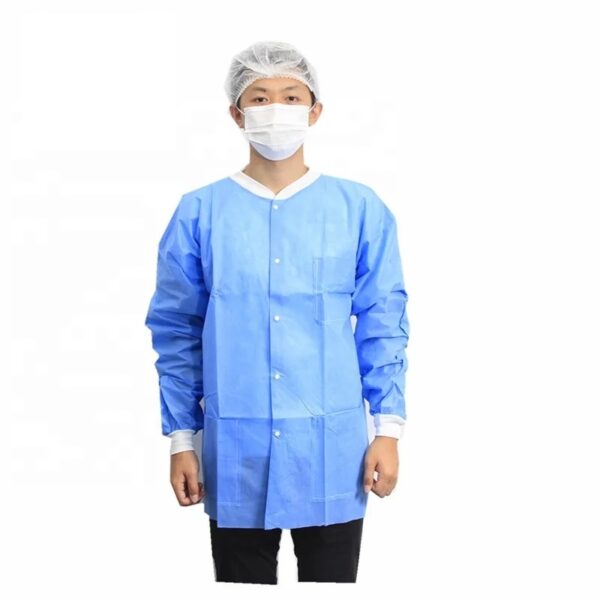 Person in blue medical gown and mask