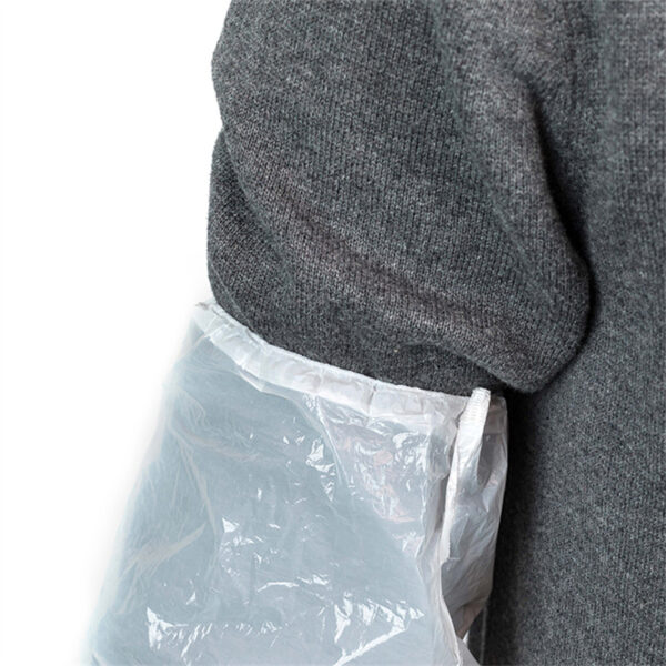 Gray sweater with plastic sleeve cover.