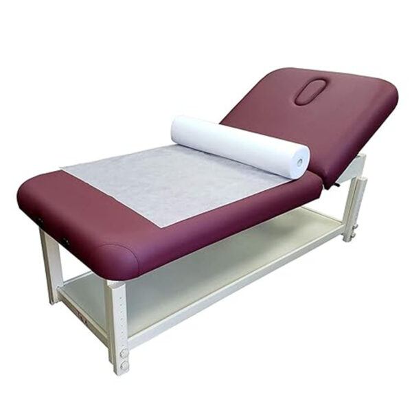 Adjustable medical examination table with paper roll.