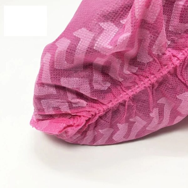 Pink disposable shoe cover with zigzag pattern