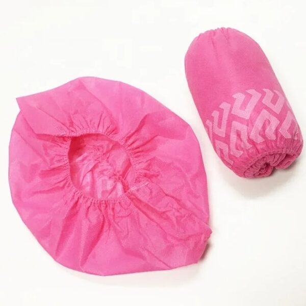 Pink hair cap and pouch on white background.