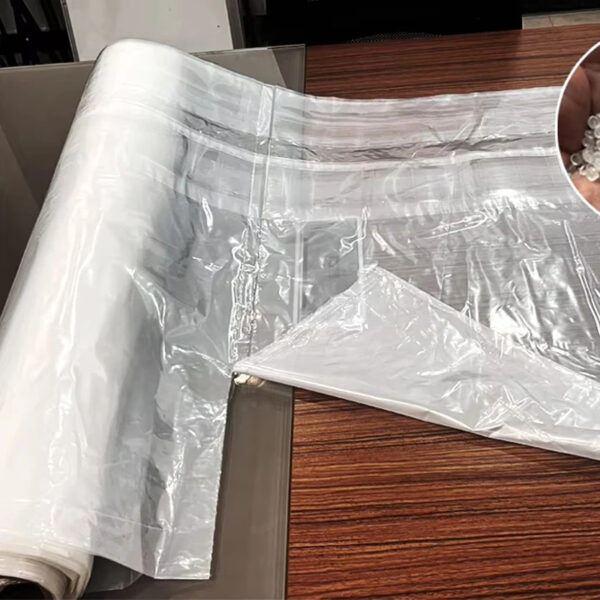 Transparent plastic sheets on wooden table surface.