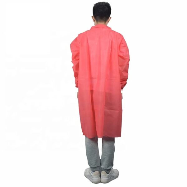 Person in pink disposable gown back view