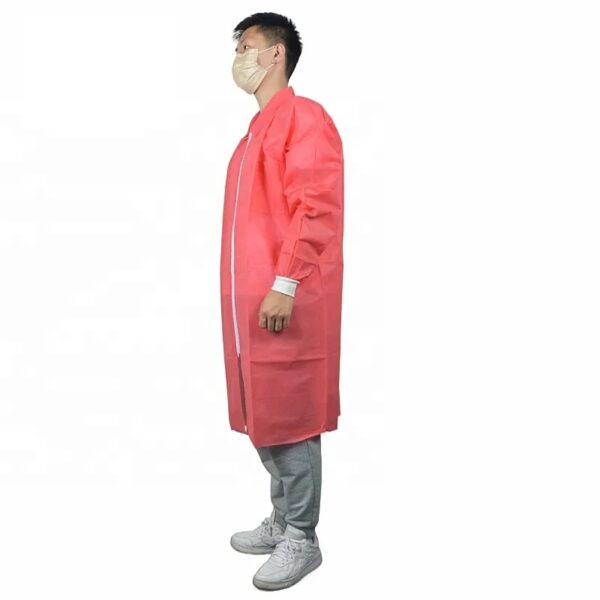 Person wearing red medical gown and mask.