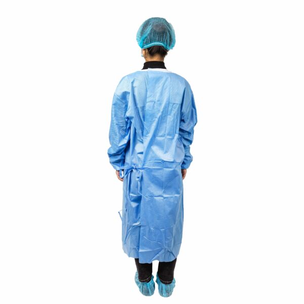 Person in blue medical gown and cap, back view.