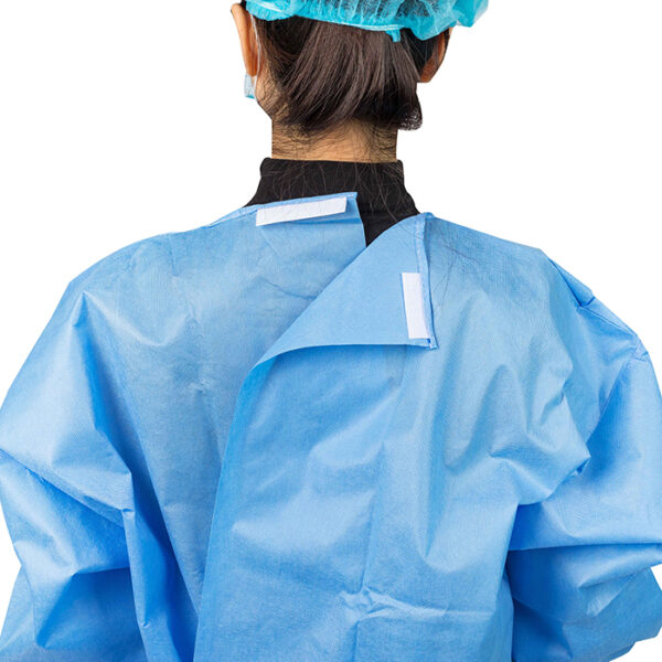 Person wearing blue medical gown and cap.