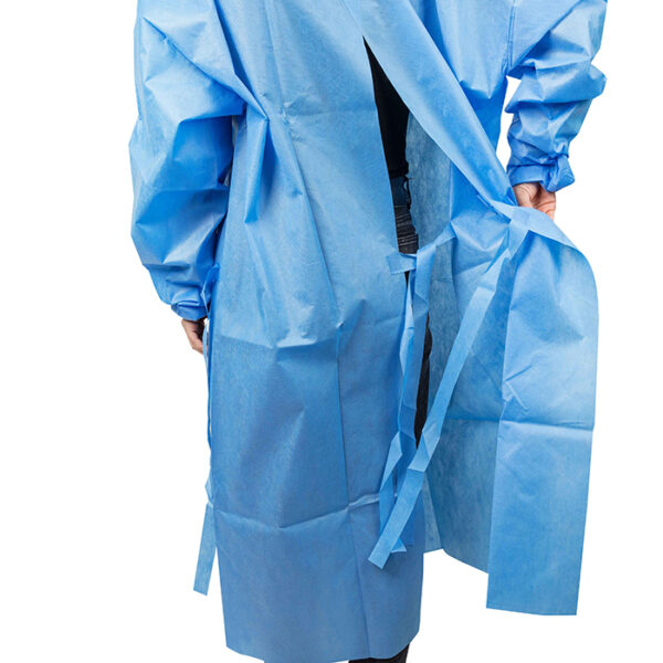 Person wearing blue protective gown with ties