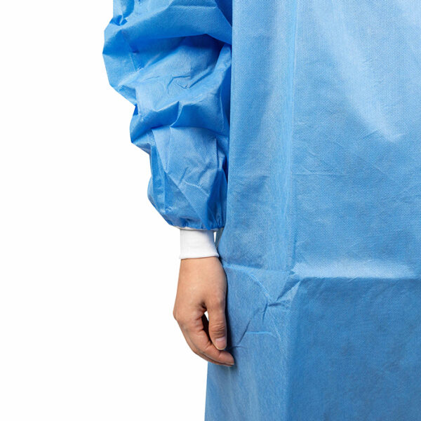 Person wearing blue medical gown close-up