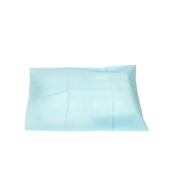 Blue disposable underpad for medical or home use.