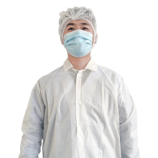 Person wearing protective medical gown and face mask.