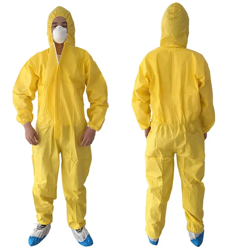 Person wearing yellow protective coveralls and mask.