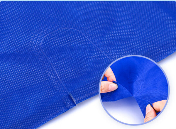 Close-up of blue non-woven fabric tear strength