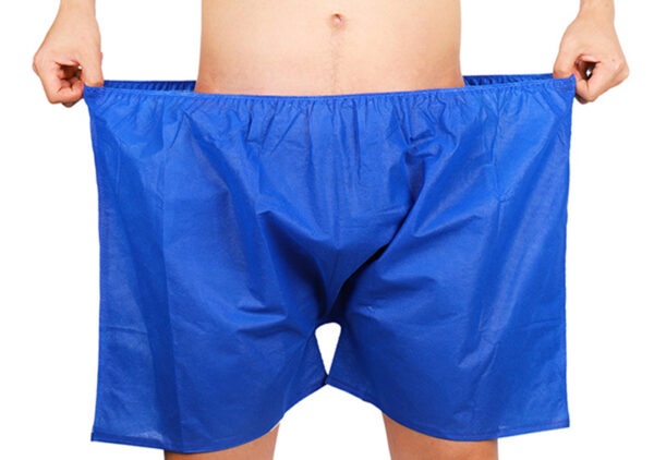 Person wearing oversized blue boxer shorts.