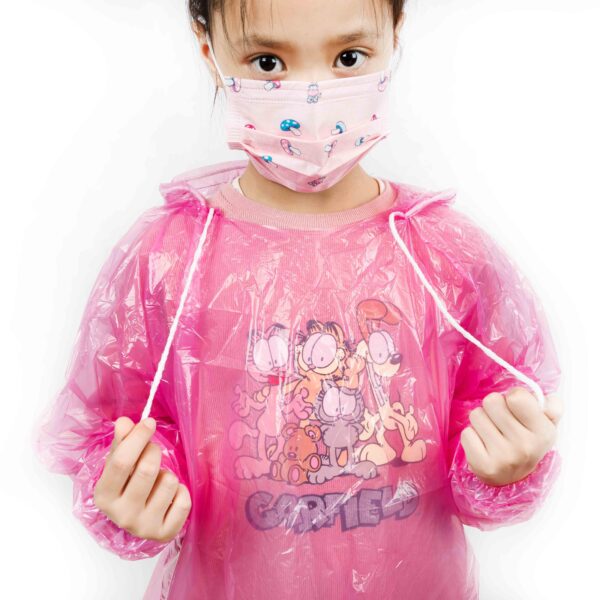 Child in pink raincoat and face mask.