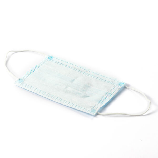 Disposable blue surgical mask on white background.