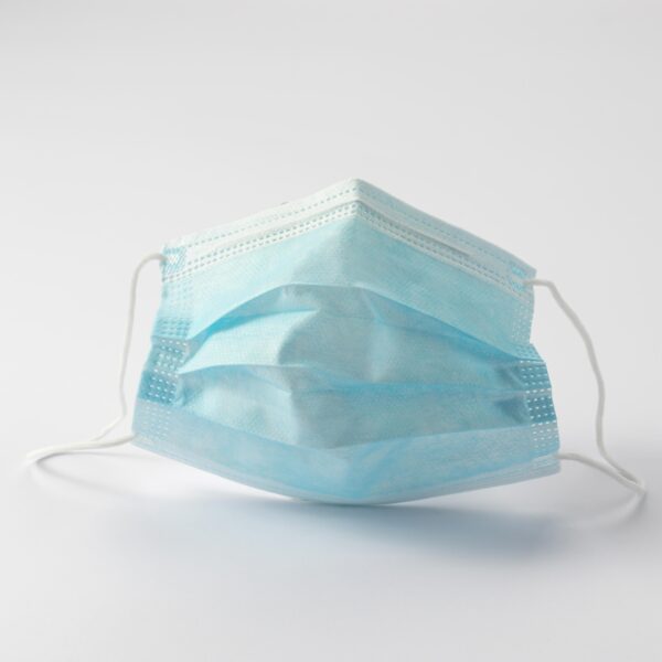 Blue surgical mask on white background