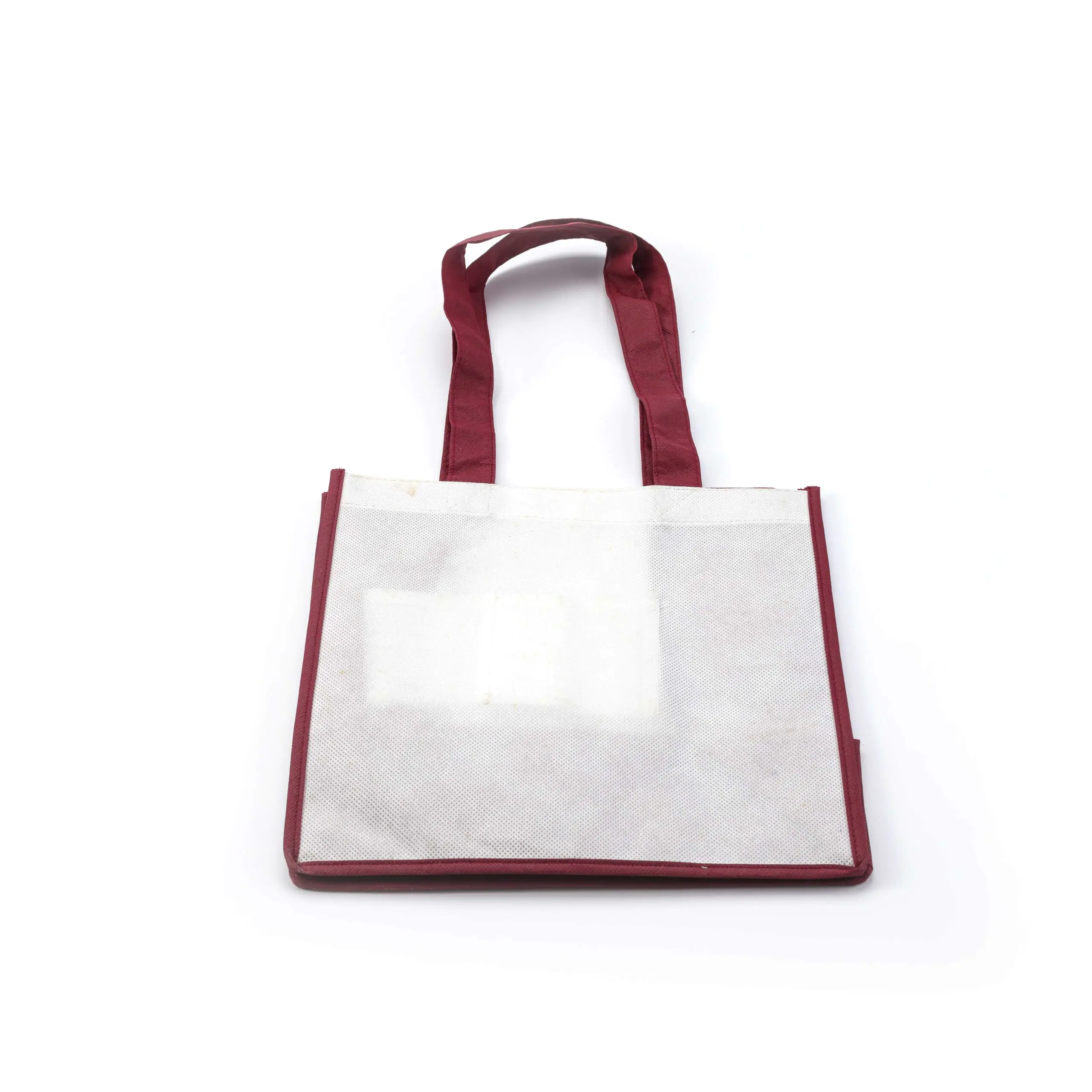 Reusable tote bag with red handles